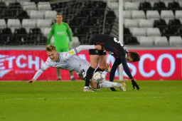 Henri Lansbury wins this 50-50 ball