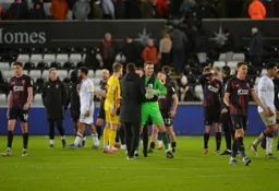 The players celebrate a win