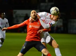 Future Hatter Mads Andersen getting handsy with Danny Hylton