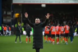 Nathan Jones celebrates with the crowd after a sensational performance at Kenilworth Road