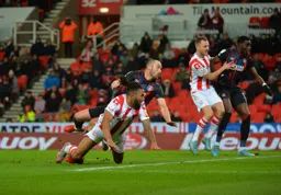 Danny Hylton sees his chance end up on target, Elijah Adebayo gets ready for a rebound