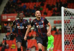 Danny Hylton wheels away having put the Hatters ahead