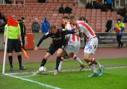 James Bree trying to keep the ball in play under pressure