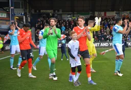 Kal Naismith, Jed Steer and Gabe Osho leading the team out