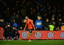 Harry Cornick races to the corner flag to celebrate his goal