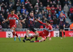 Allan Campbell doing what he does best, battling in midfield