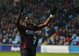 Elijah Adebayo laps up the plaudits from the travelling Hatters