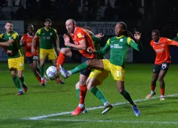 Danny Hylton challenging for the ball in the area