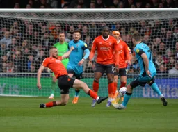 Allan Campbell about to tackle Jed Wallace