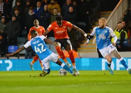 Elijah Adebayo trying to beat the Peterborough defence