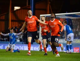 The players celebrate the opening goal
