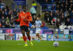 Pelly-Ruddock Mpanzu plays a sideway pass
