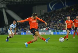 Harry Cornick sends in a cross
