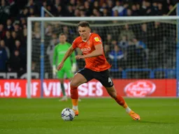 Kal Naismith bringing the ball out of defence