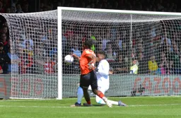 Fred Onyedinma gets closed down by Brice Samba