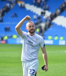 Allan Campbell salutes the travelling fans