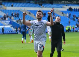 Robert Snodgrass celebrates with the travelling fans