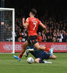 Harry Cornick tries to round the keeper