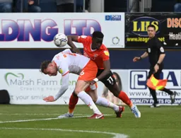 Elijah Adebayo getting touch tight with Richard Keogh
