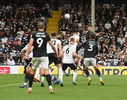 Tom Lockyer flicks the ball on