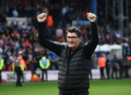 Mick Harford celebrating making the playoffs