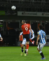 Danny Hylton nods the ball on