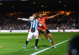 Harry Cornick trying to keep the ball in play