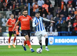 Robert Snodgrass battles for the ball