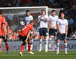 James Bree`s free kick beats the defensive wall but with no result