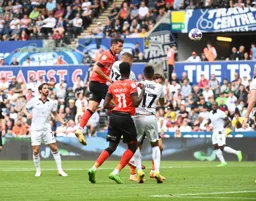 Dan Potts sends a header towards goal