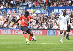Elijah Adebayo lines up a shot at goal