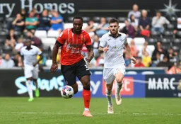 Cameron Jerome moves forward with the ball