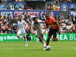 Carlton Morris races away from Ben Cabango