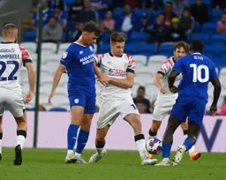 Reece Burke goes in for a tackle against Sheyi Ojo