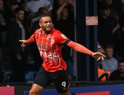 Carlton Morris is happy after scoring his goal
