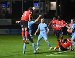 Dan Potts wins an attacking header