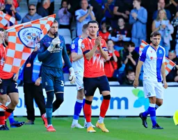 Dan Potts leads the team out