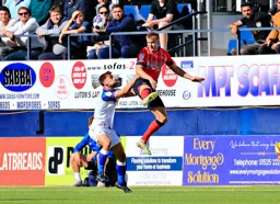 James Bree heads the ball on