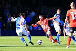 Jordan Clark and Tyrhys Dolan both go for the ball