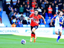 Tom Lockyer chases the ball down