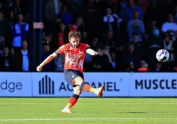 Tom Lockyer plays the ball up field