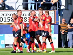 Henri Lansbury congratulates Reece Burke