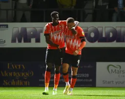 Elijah Adebayo and Carlton Morris are all smiles after Adebayo has scored the Town`s first goal