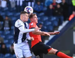 James Bree competes for the ball against Conor Townsend