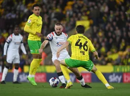 Allan Campbell cuts inside Liam Gibbs