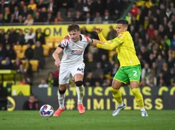 Alfie Doughty holds off Max Aarons