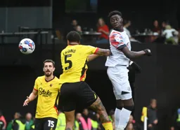 Elijah Adebayo flicks the ball on with his head