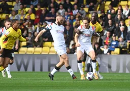 Allan Campbell takes the ball off Tom Lockyer