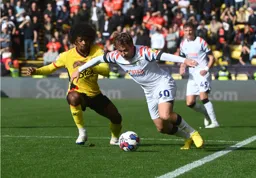 Luke Freeman goes past Hamza Choudhury