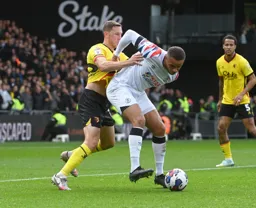 Carlton Morris backs into Dan Gosling